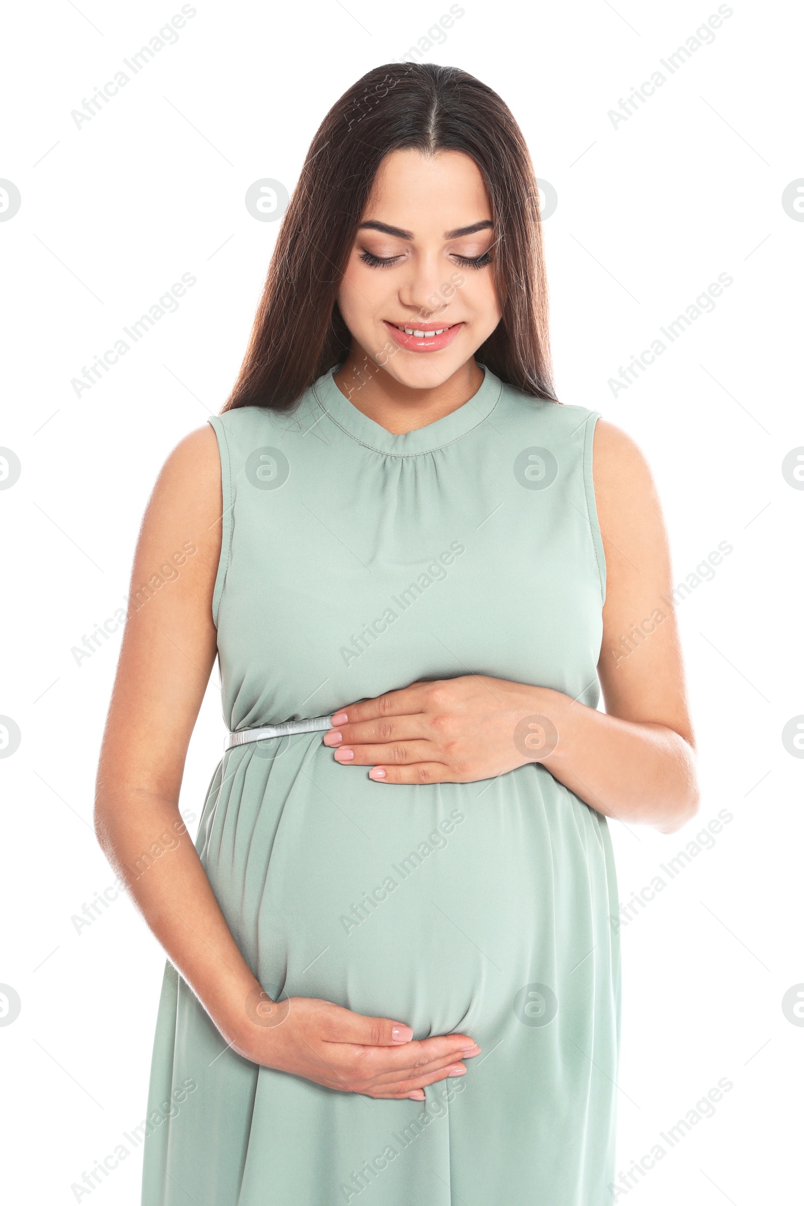 Photo of Portrait of beautiful young pregnant woman in dress on white background