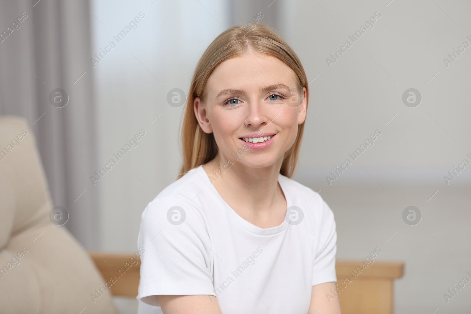 Photo of Portrait of beautiful young woman at home