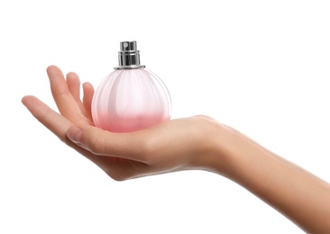 Young woman with perfume bottle on white background, closeup