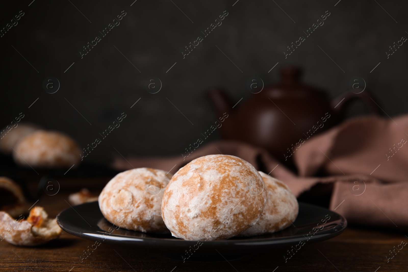 Photo of Tasty homemade gingerbread cookies on wooden table, space for text