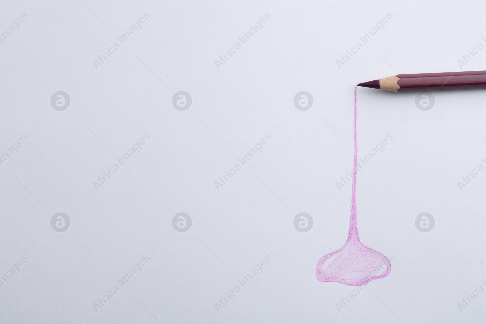 Photo of Abstract drawing and color pencil on white background, top view