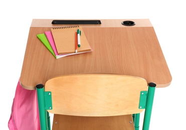 Wooden school desk with stationery and backpack on white background