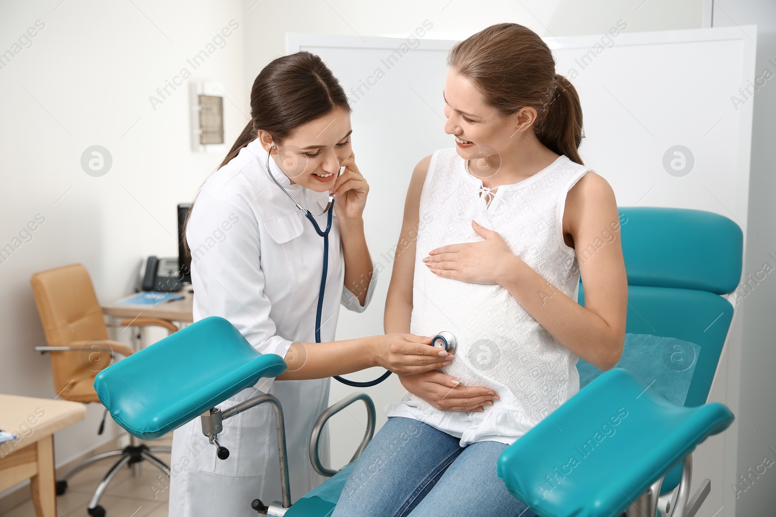 Photo of Pregnant woman having appointment at gynecologist office