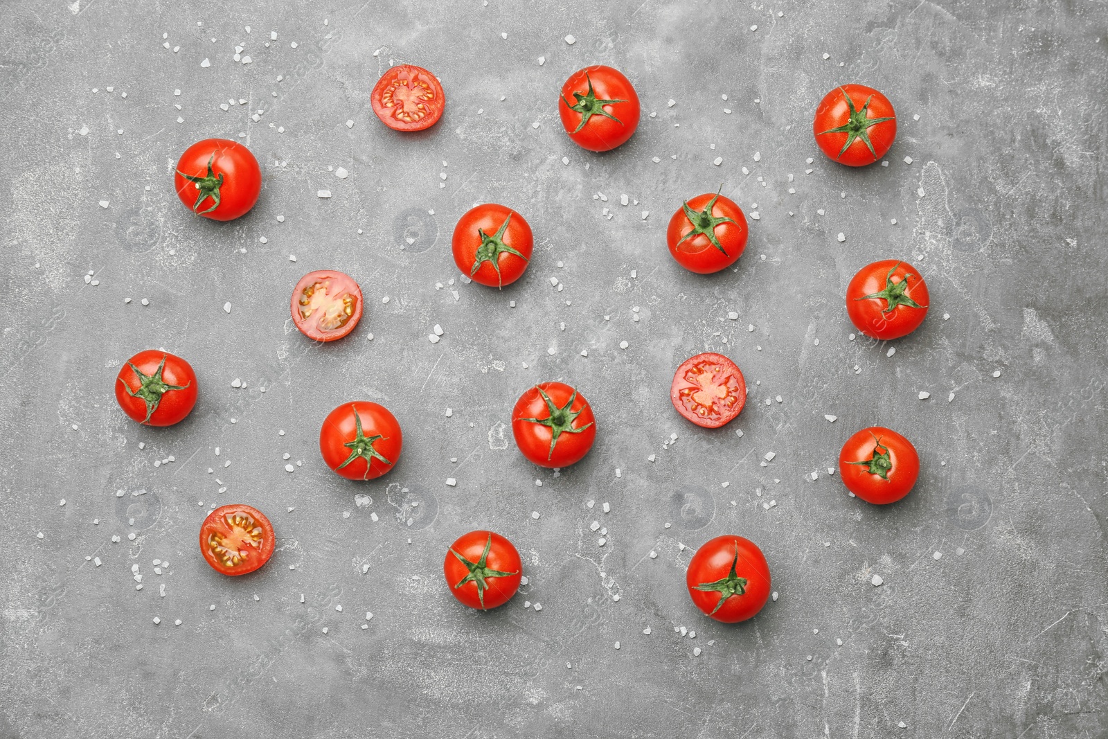 Photo of Flat lay composition with ripe tomatoes on grey background