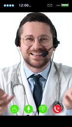 Online medical consultation. Doctor with headset working via video chat application