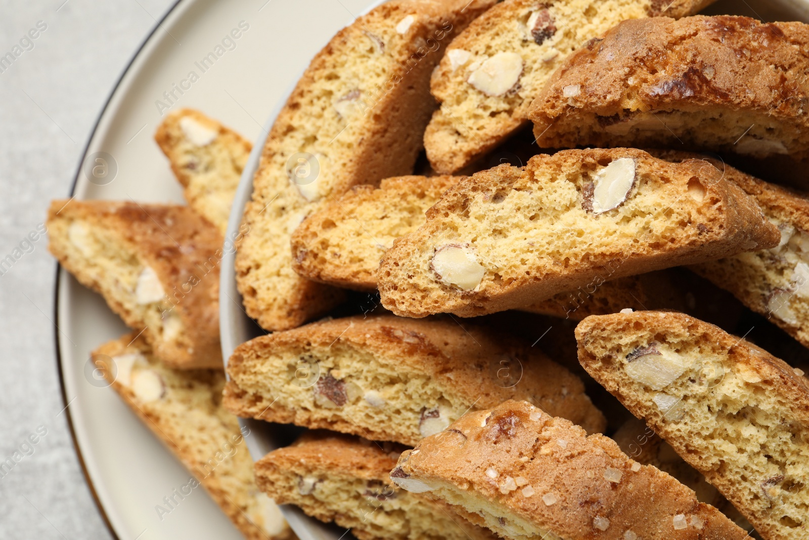 Photo of Traditional Italian almond biscuits (Cantucci) on plate, closeup