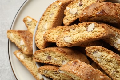 Traditional Italian almond biscuits (Cantucci) on plate, closeup