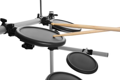Photo of Modern electronic drum kit with sticks on white background. Music instrument