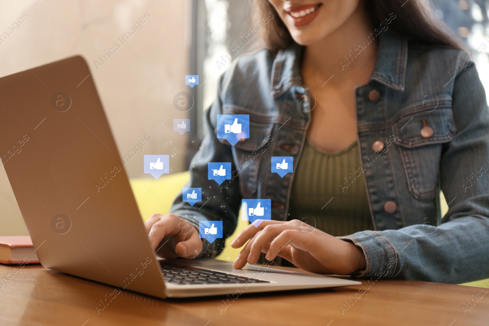 Image of Blogger working with laptop in cafe, closeup