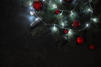 Photo of Christmas decoration on stone background, flat lay. Space for text