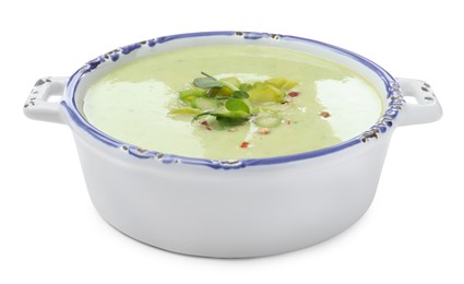 Delicious asparagus soup in bowl on white background