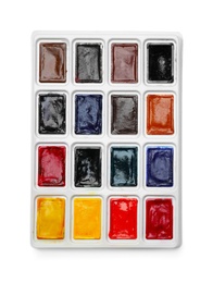Plastic palette with colorful paints on white background, top view