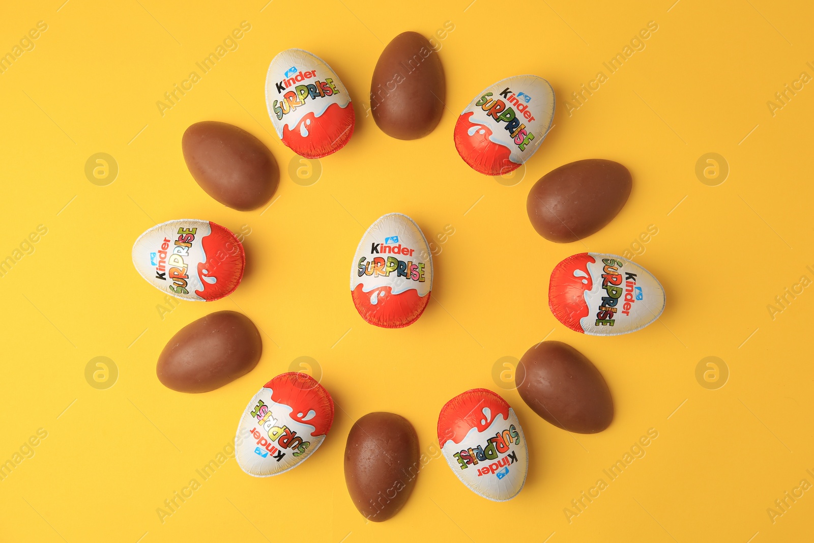 Photo of Sveti Vlas, Bulgaria - June 29, 2023: Kinder Surprise Eggs on orange background, flat lay