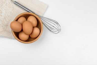 Photo of Flat lay composition with raw eggs on white table, space for text. Baking pie