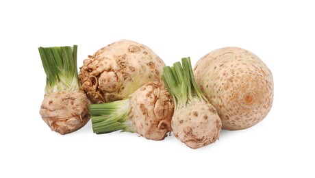 Photo of Many raw celery roots isolated on white