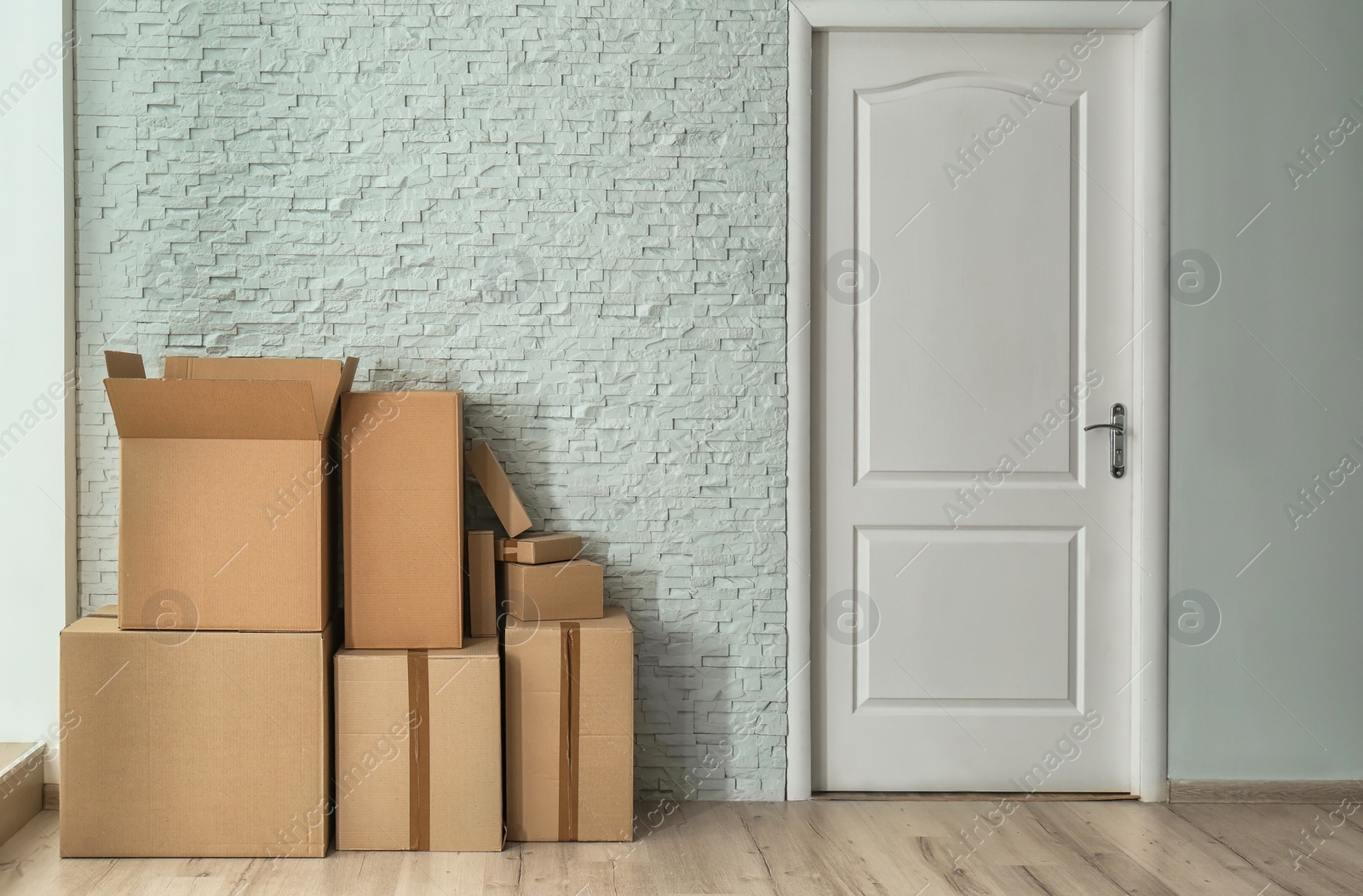 Photo of Cardboard boxes on floor indoors