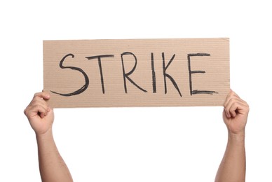 Photo of Man holding cardboard banner with word Strike on white background, closeup