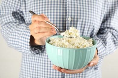 Photo of Woman with bowl of cottage cheese, closeup