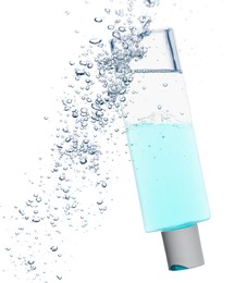 Photo of Bottle of micellar water with bubbles on white background