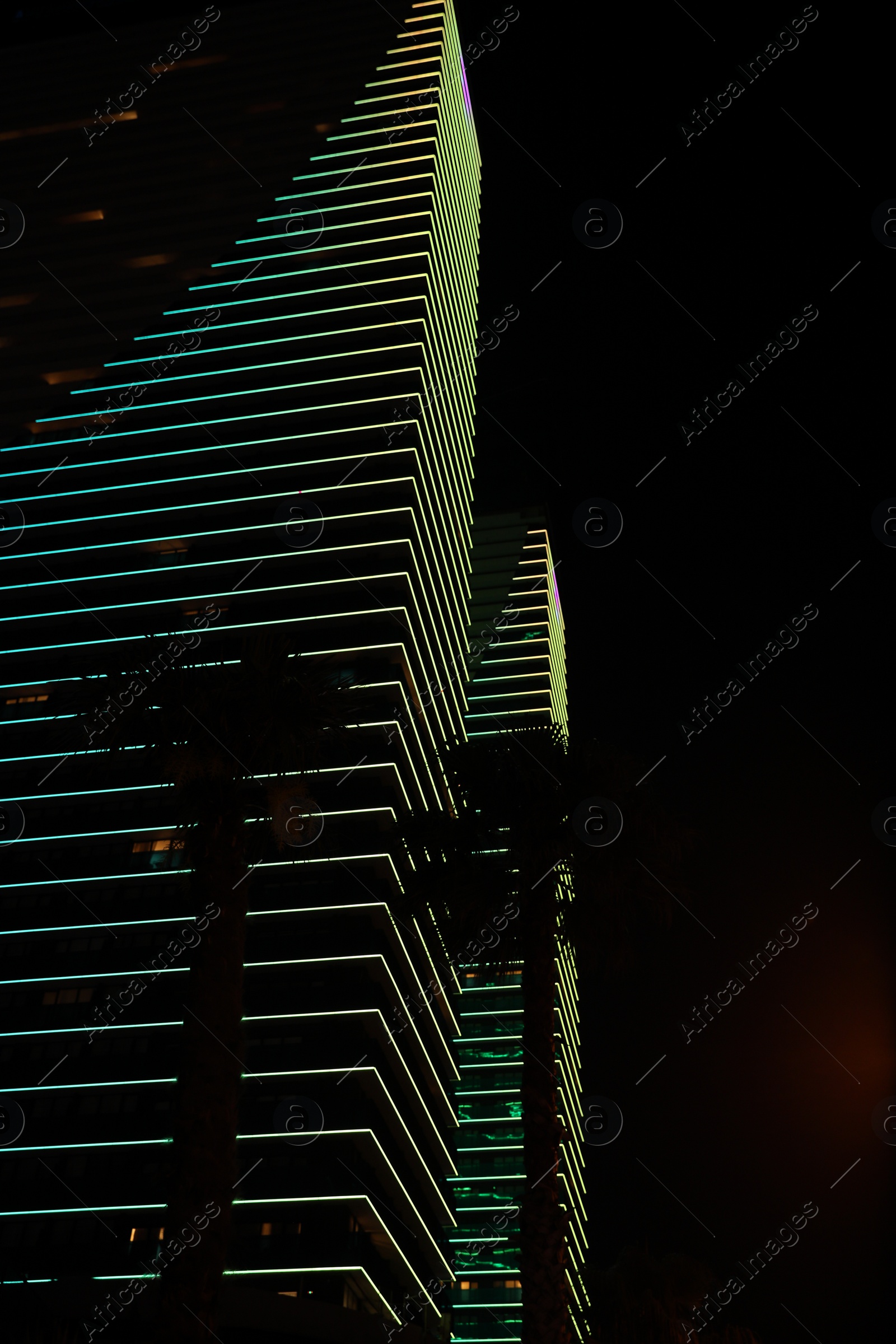 Photo of BATUMI, GEORGIA - JUNE 09, 2022: View of night cityscape with illuminated buildings