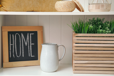 White shelving unit with different decorative stuff