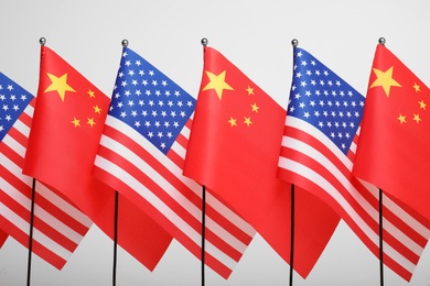 USA and China flags on white background. International relations