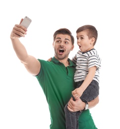 Photo of Portrait of dad taking selfie with his son isolated on white