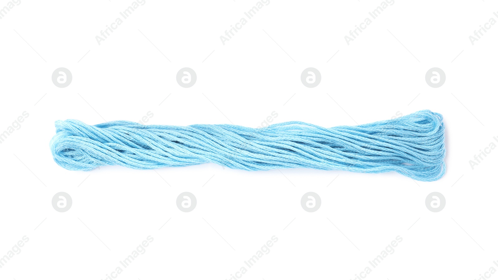 Photo of Light blue embroidery thread on white background