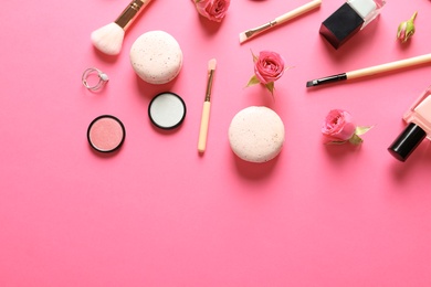 Flat lay composition with products for decorative makeup on pink background