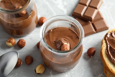 Photo of Sweet chocolate mousse served on marble table, view from above