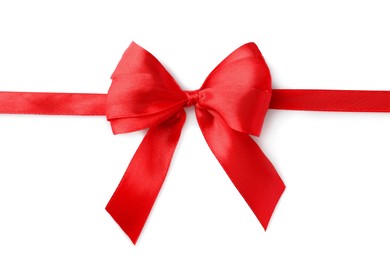 Photo of Red bow and ribbon on white background, top view