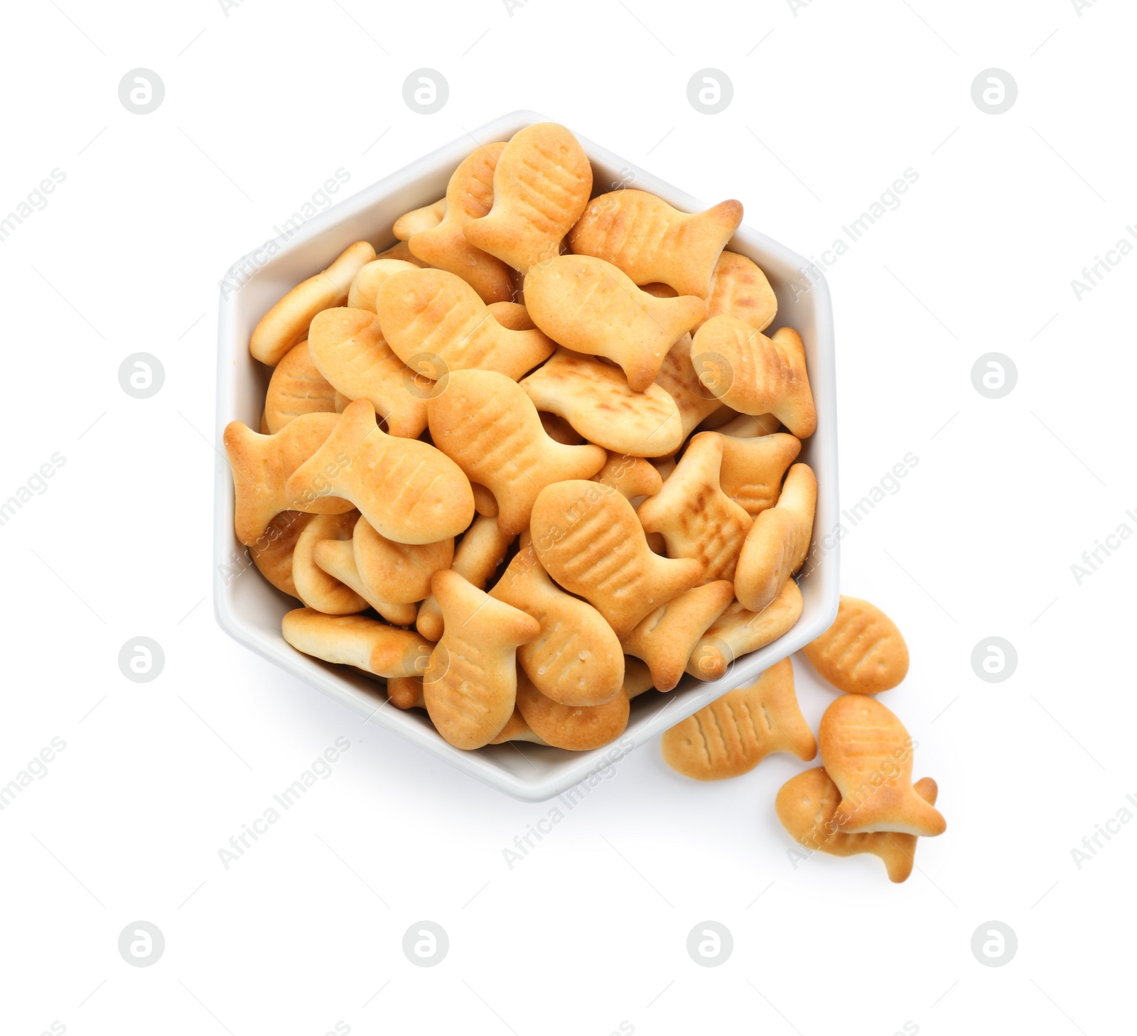 Photo of Delicious goldfish crackers in bowl isolated on white