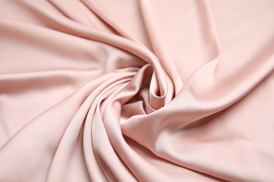 Photo of Texture of delicate pink silk as background, top view