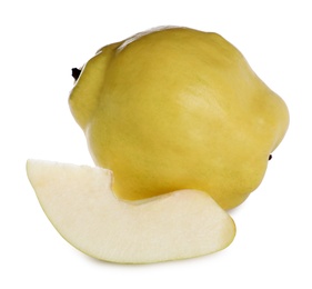 Photo of Whole and cut delicious quinces on white background