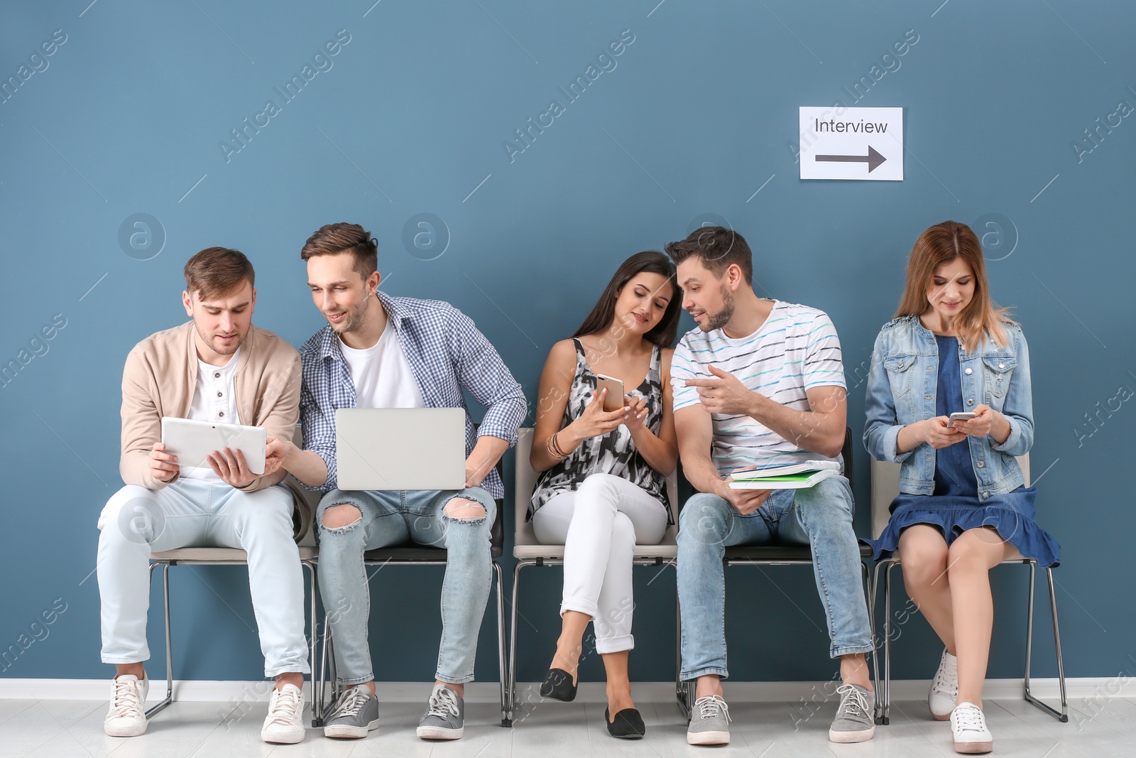 Photo of Group of people waiting for job interview, indoors