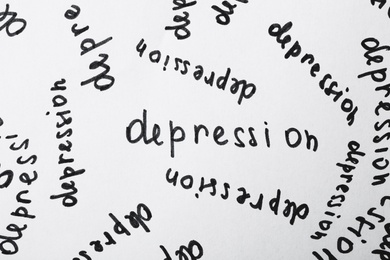 Photo of Many written words Depression on white paper as background, top view