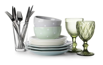 Photo of Set of beautiful ceramic dishware, glasses and cutlery isolated on white