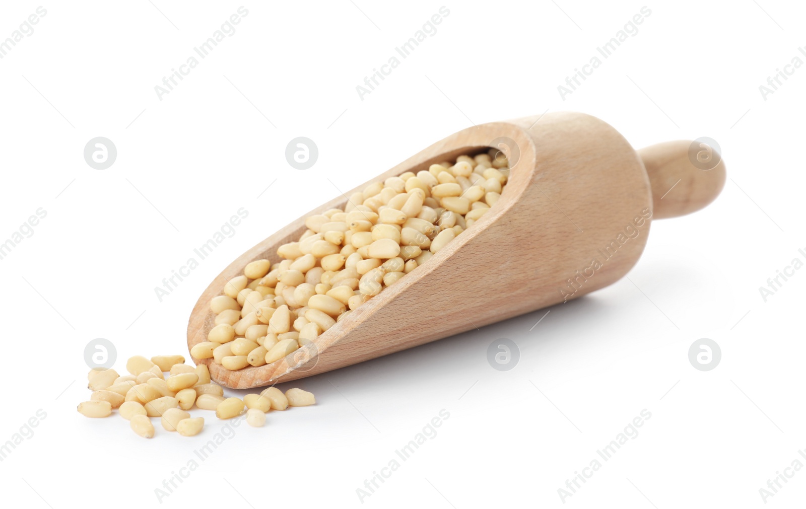 Photo of Scoop with pine nuts on white background