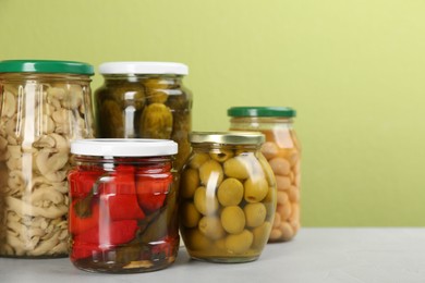 Photo of Jars of pickled vegetables on light table