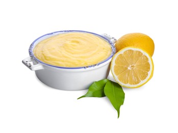 Photo of Delicious lemon curd in bowl, fresh citrus fruits and green leaves isolated on white