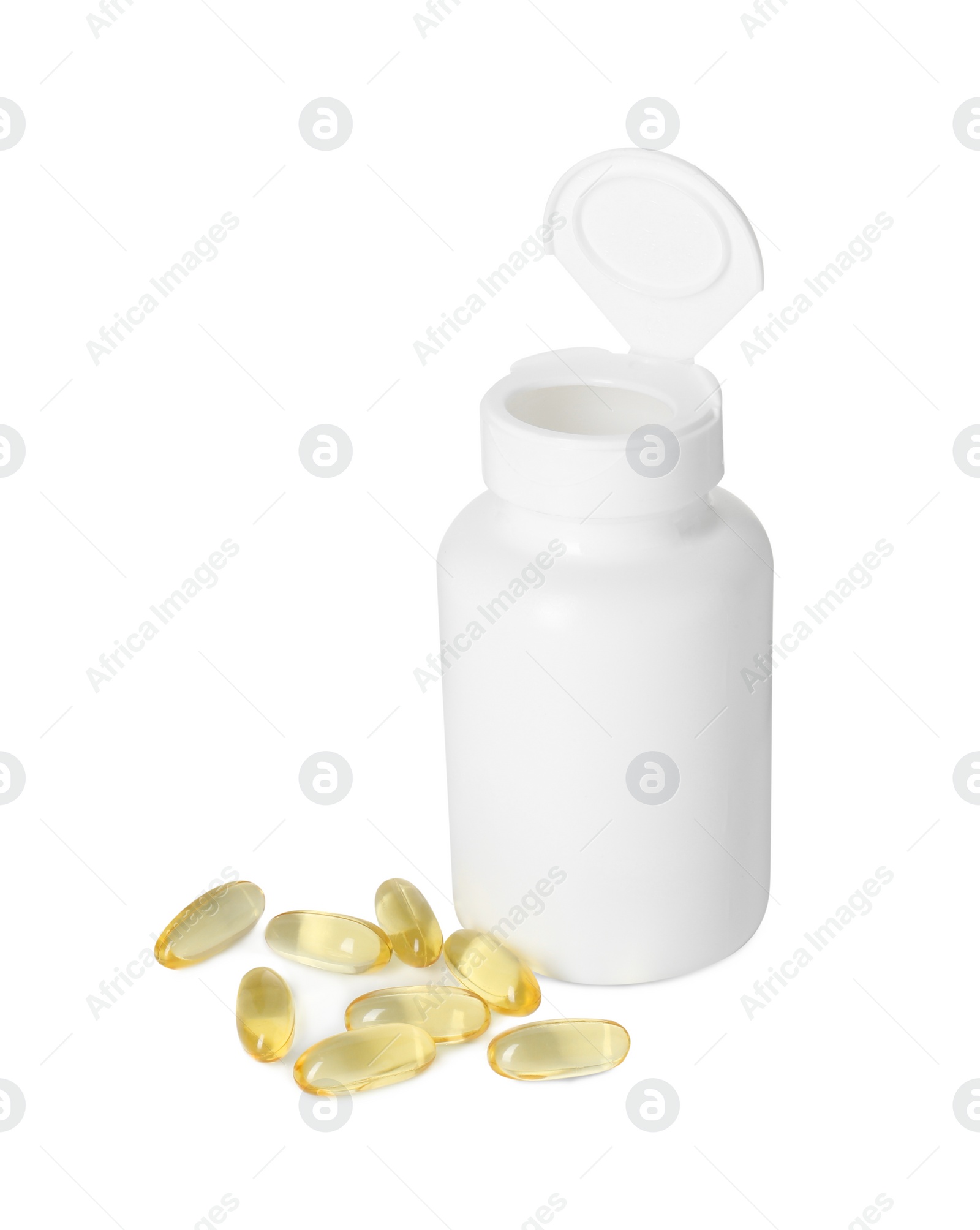 Photo of Bottle and pile of softgel capsules isolated on white