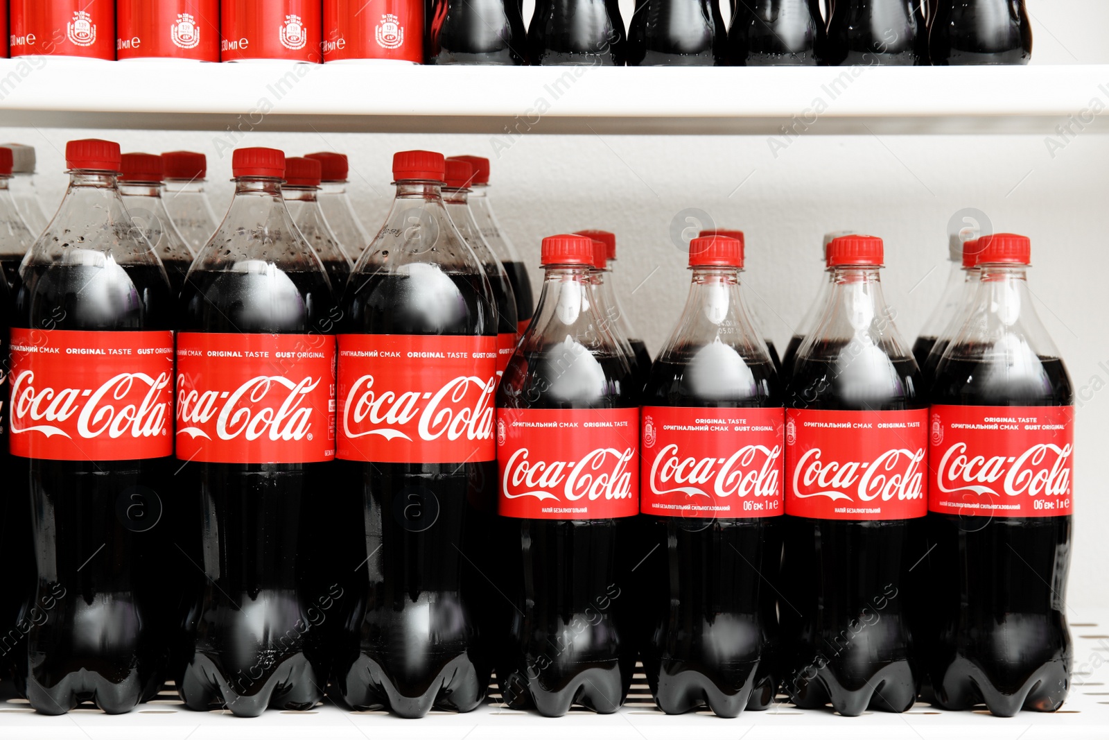 Photo of MYKOLAIV, UKRAINE - NOVEMBER 14, 2018: Many bottles of Coca-Cola on display in store