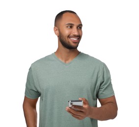 Happy man sending message via smartphone on white background