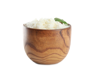 Photo of Wooden bowl with cooked rice and parsley isolated on white