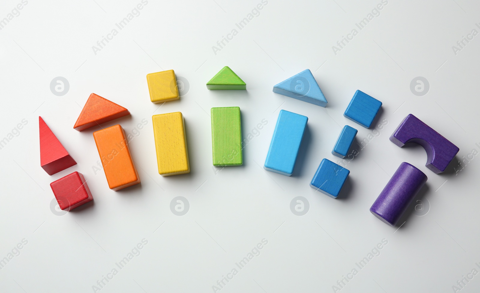 Photo of Colorful wooden construction set on white background top view