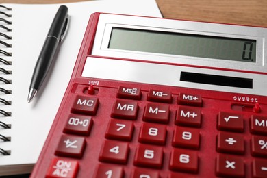 Calculator and office stationery on table, closeup