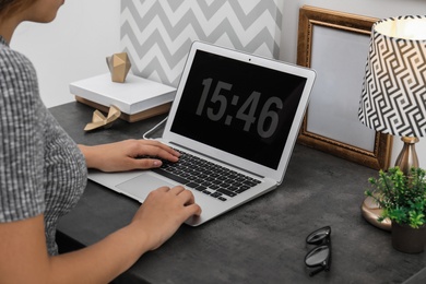 Woman using computer in home office. Stylish workplace