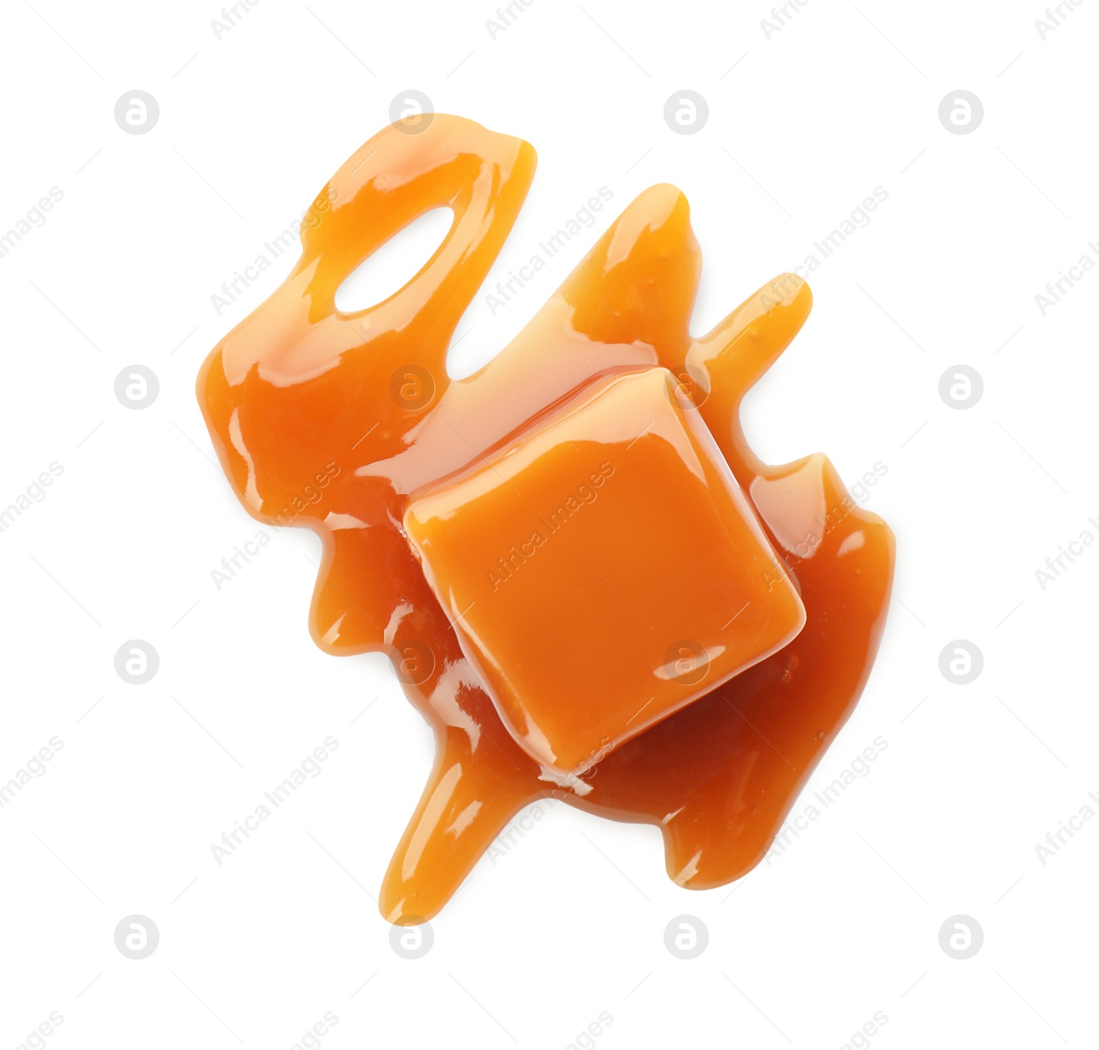 Photo of Sweet caramel candy with topping isolated on white, top view