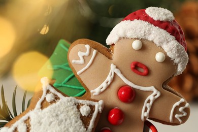 Delicious homemade Christmas cookies against blurred festive lights, closeup