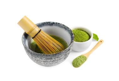 Photo of Cup of fresh matcha tea with bamboo whisk and green powder isolated on white